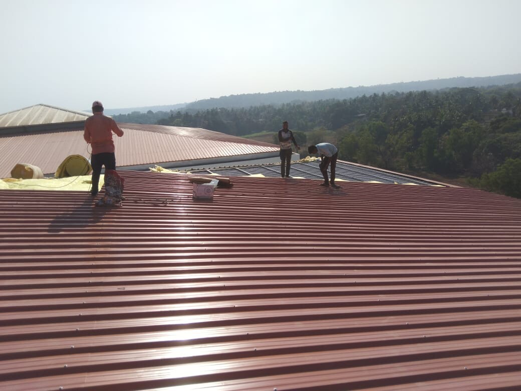 Architectural standing seam roofing for Lodha Mumbai: Premium metal building envelope featuring a minimalist aesthetic and hidden fastener technology by Rishonn & Reyansh.